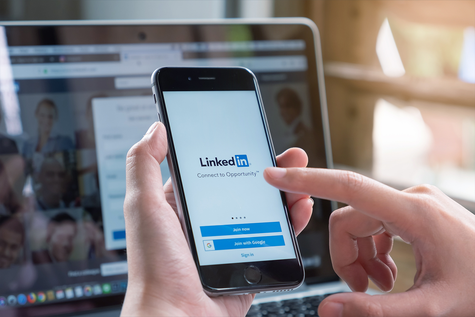 iPhone X with LinkedIn application on the screen. LinkedIn is a business-oriented social networking service.